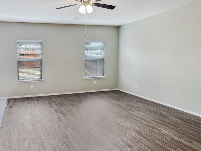 unfurnished room with wood-type flooring and ceiling fan