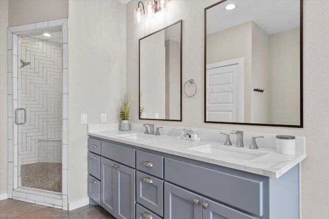 117 Nakalele Ln, Bastrop, TX 78602 - bathroom featuring a shower stall, double vanity, and tile patterned flooring