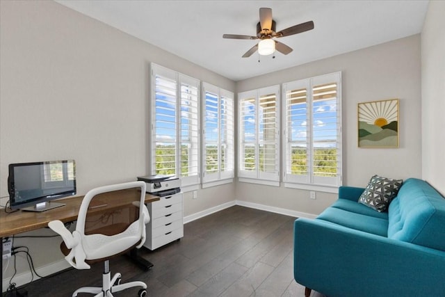 home office with dark hardwood / wood-style flooring, plenty of natural light, and ceiling fan