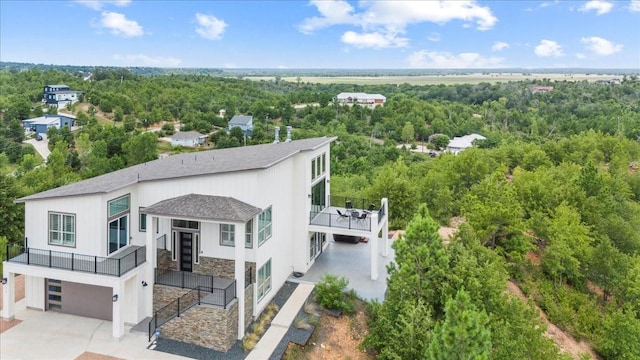 117 Nakalele Ln, Bastrop, TX 78602 - aerial view of property and surrounding area featuring a heavily wooded area