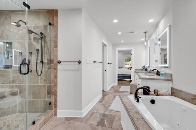 1027 Challenger, Lakeway, TX 78734 - full bathroom with baseboards, a whirlpool tub, a stall shower, ensuite bathroom, and recessed lighting