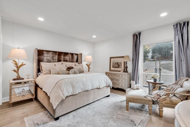 1027 Challenger, Lakeway, TX 78734 - bedroom with light wood-style floors and recessed lighting