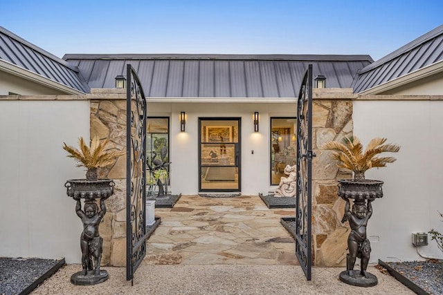 1027 Challenger, Lakeway, TX 78734 - view of exterior entry with metal roof and stucco siding
