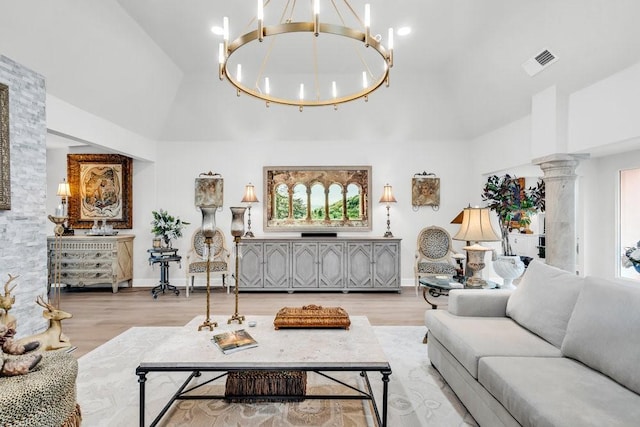 1027 Challenger, Lakeway, TX 78734 - living room featuring a chandelier, high vaulted ceiling, wood finished floors, and decorative columns