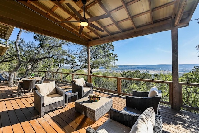 deck featuring outdoor lounge area and ceiling fan