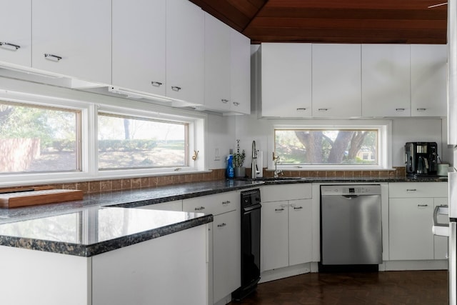 kitchen featuring stainless steel dishwasher, sink, dark parquet floors, and white cabinets