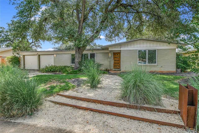 ranch-style home with a garage