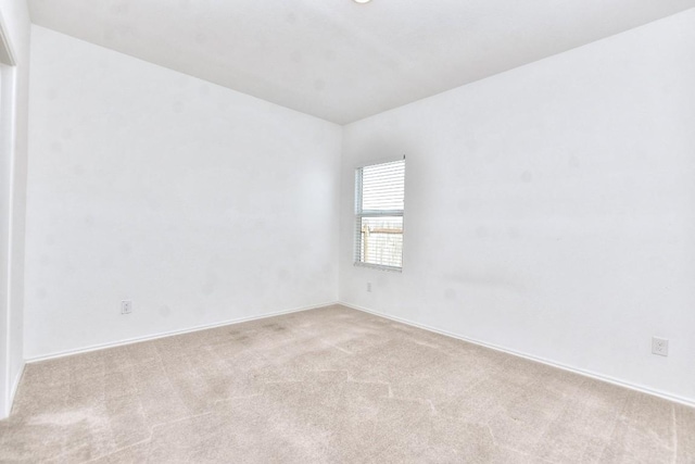 unfurnished room featuring carpet floors