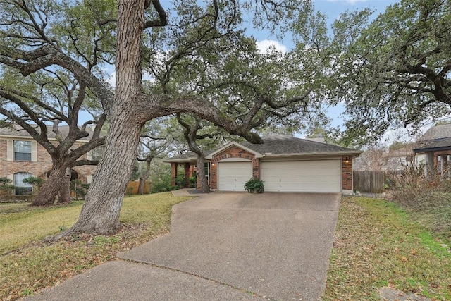 view of front of property with a garage and a front yard