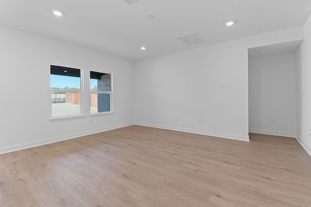 spare room with light hardwood / wood-style floors