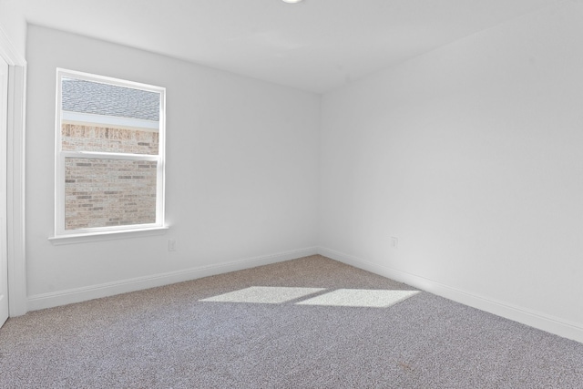 unfurnished room featuring carpet