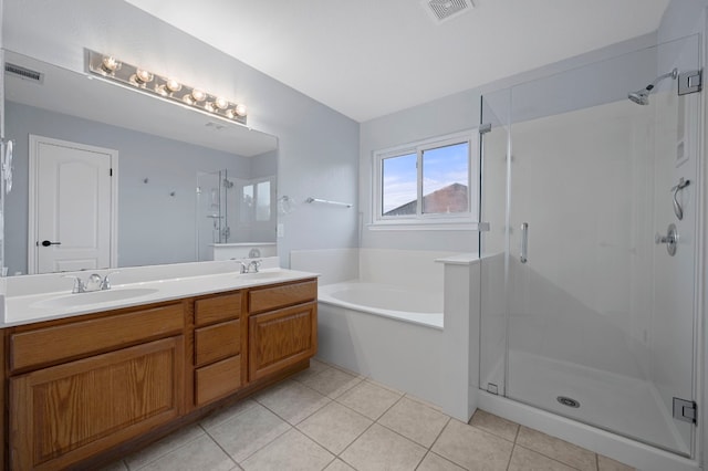 full bath with a sink, a stall shower, a garden tub, and visible vents