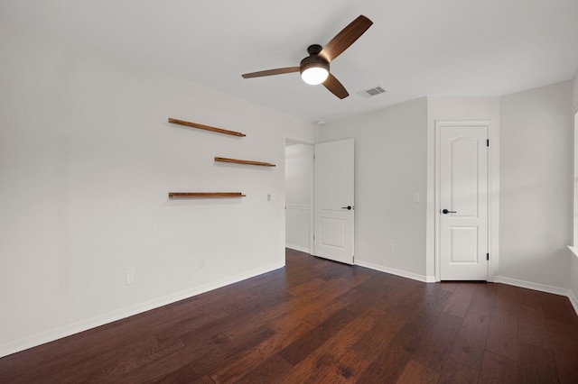unfurnished bedroom featuring visible vents, a ceiling fan, baseboards, and wood finished floors