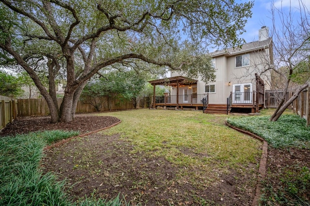 view of yard with a fenced backyard and a wooden deck