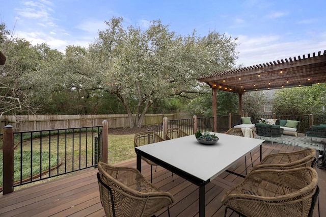 wooden deck featuring a pergola, an outdoor living space, outdoor dining area, and a fenced backyard