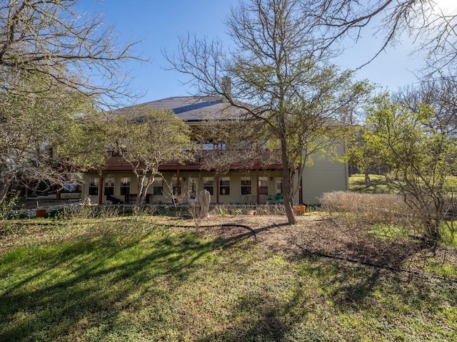 back of house with a yard