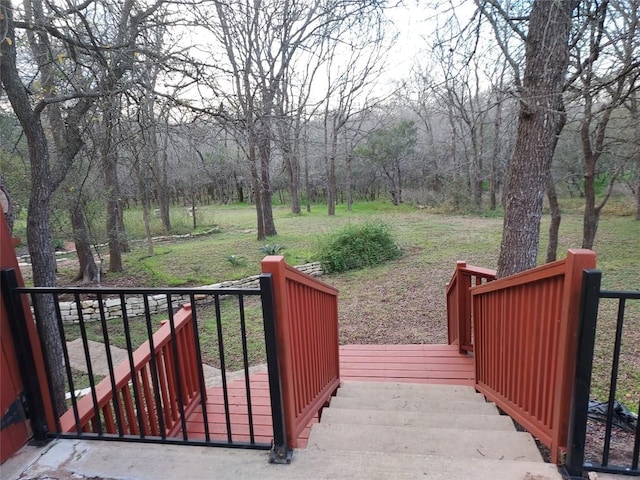 wooden deck featuring a yard