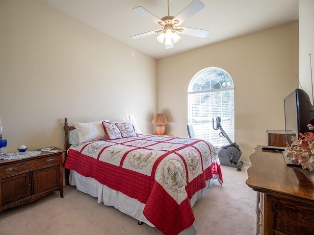 bedroom featuring ceiling fan and light colored carpet