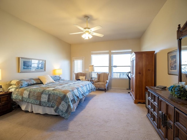 carpeted bedroom with lofted ceiling and ceiling fan