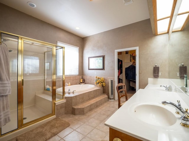 bathroom featuring vanity, tile patterned floors, and plus walk in shower