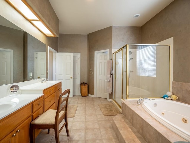 bathroom with vanity and separate shower and tub