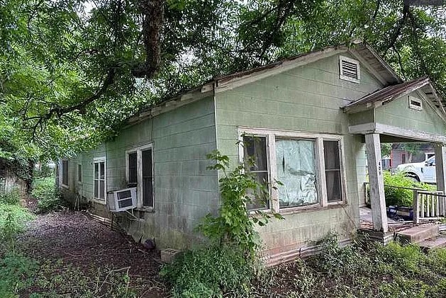 view of side of property featuring cooling unit