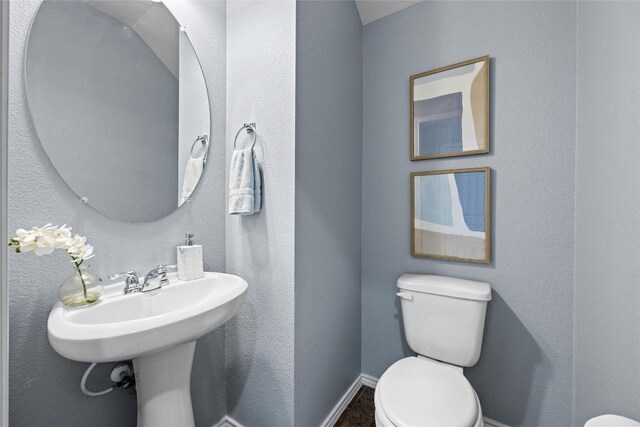 bathroom featuring toilet