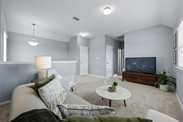 carpeted living room featuring lofted ceiling