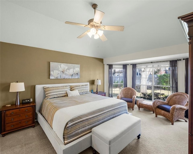 bedroom with ceiling fan and light colored carpet