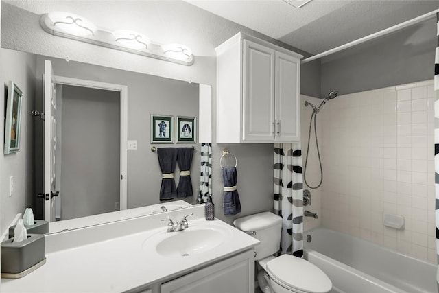 full bathroom with vanity, toilet, shower / tub combo, and a textured ceiling