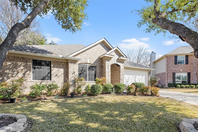 view of front facade with a garage and a front yard