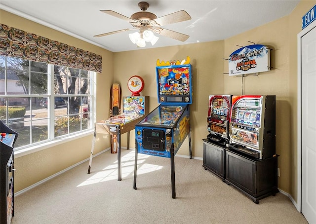 carpeted home office featuring ceiling fan