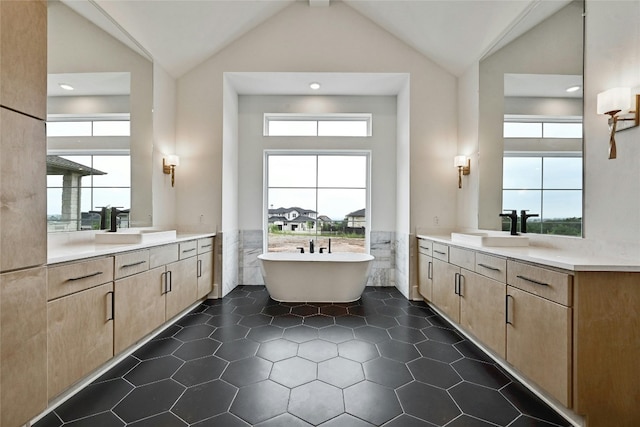 bathroom with tile walls, a bath, vanity, and high vaulted ceiling