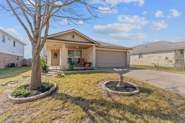 ranch-style home with a porch, a garage, central AC unit, and a front lawn