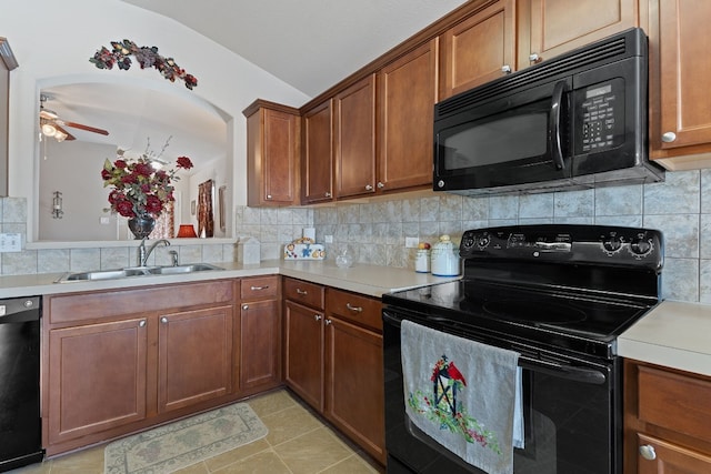 kitchen with sink, backsplash, ceiling fan, and black appliances