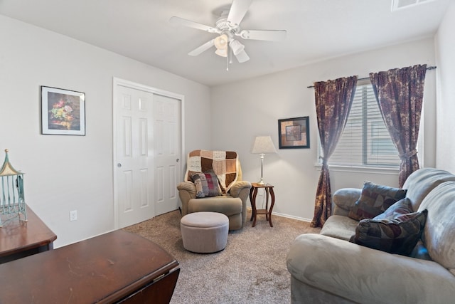 sitting room with carpet floors and ceiling fan