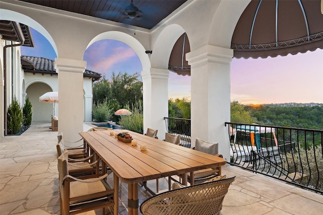 4908 Mirador Dr, Austin, TX 78735 - patio terrace at dusk featuring a ceiling fan and outdoor dining area