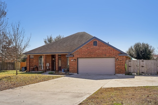 ranch-style house featuring a garage and a front lawn