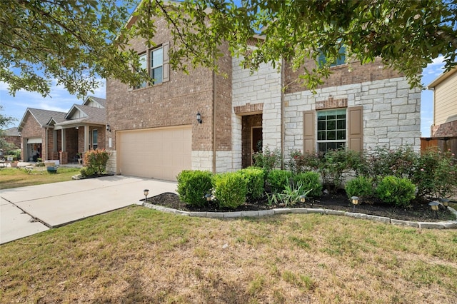 view of front of property featuring an attached garage, brick siding, a front yard, and concrete driveway