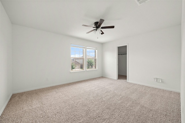 unfurnished bedroom featuring carpet flooring, ceiling fan, and a closet