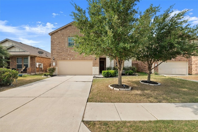 view of front of property featuring brick siding, an attached garage, a front yard, and concrete driveway