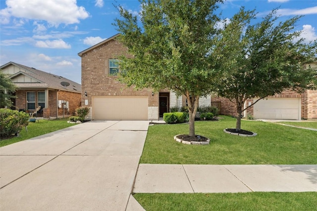 21005 Isle Of Glass St, Pflugerville, TX 78660 - view of front of property with brick siding, a front yard, driveway, and a garage