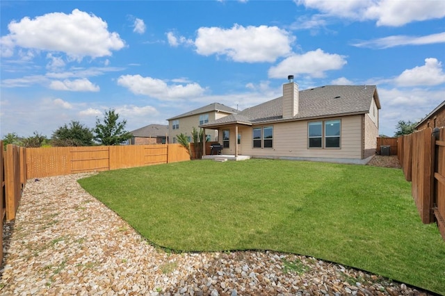 21005 Isle Of Glass St, Pflugerville, TX 78660 - back of property with a chimney, a patio, and central air condition unit