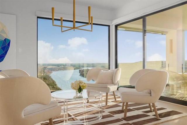 sunroom / solarium with a water view