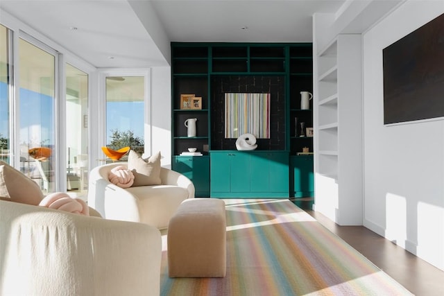 living room with floor to ceiling windows and a wealth of natural light