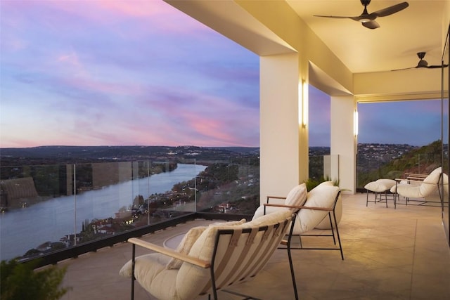 balcony at dusk with ceiling fan