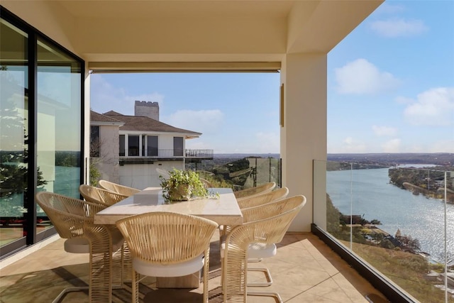 balcony featuring a water view