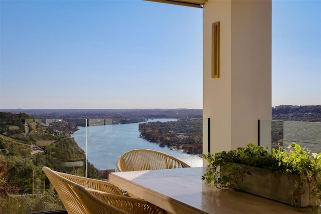 balcony featuring a water view