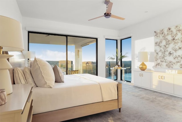 bedroom with ceiling fan, access to exterior, and carpet flooring