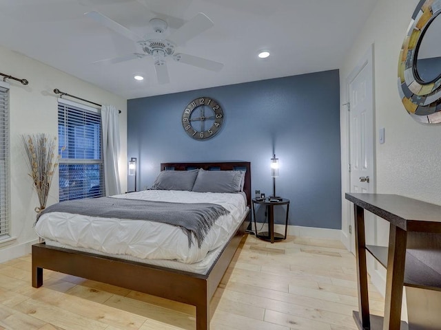 bedroom featuring ceiling fan and light wood-type flooring